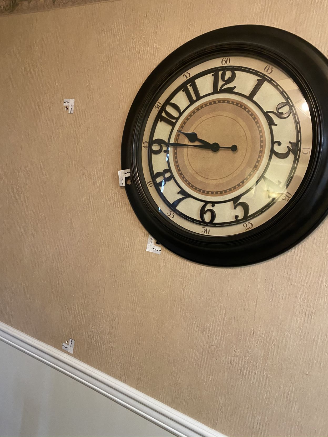 LMPD Shooting - Holes in Wall Near Clock.JPEG